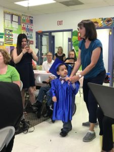 Child in graduation cap and gown